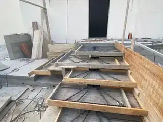 Concrete step and landing preparation with wood forming before finishing